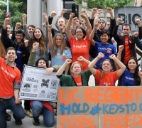 Fossil Free UC student activists celebrating having their voices heard at a Board of Regents meeting
