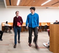 Two patrons walking in Arts Library